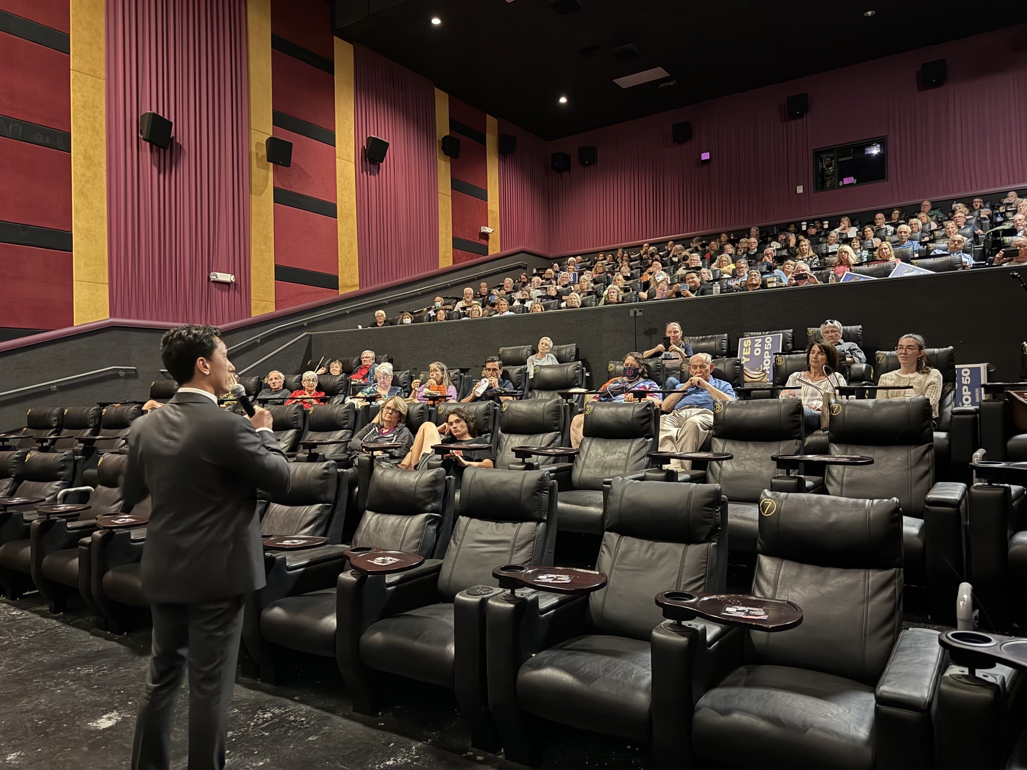 Julian speaking to the community