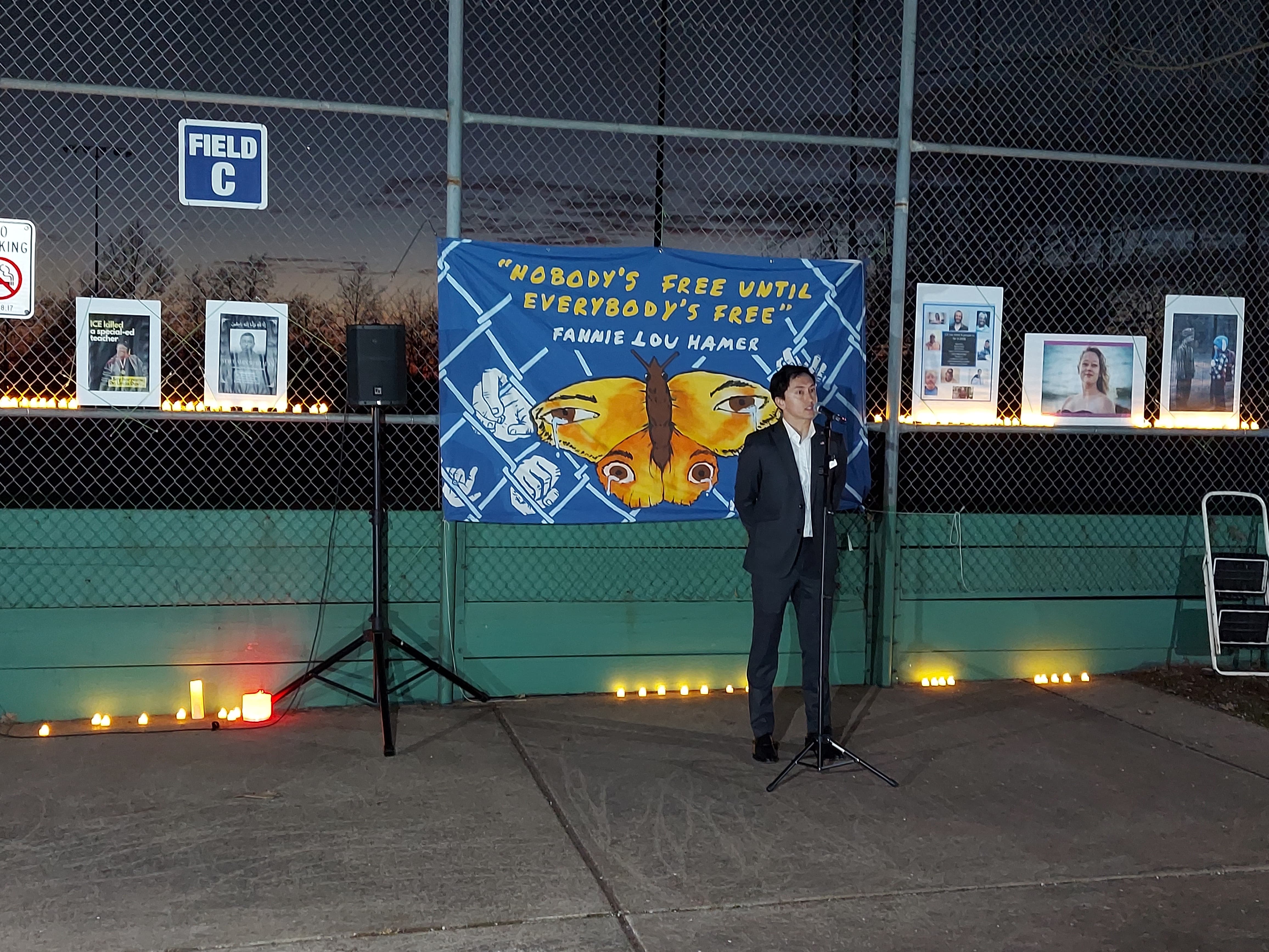 Julian speaking at community vigil